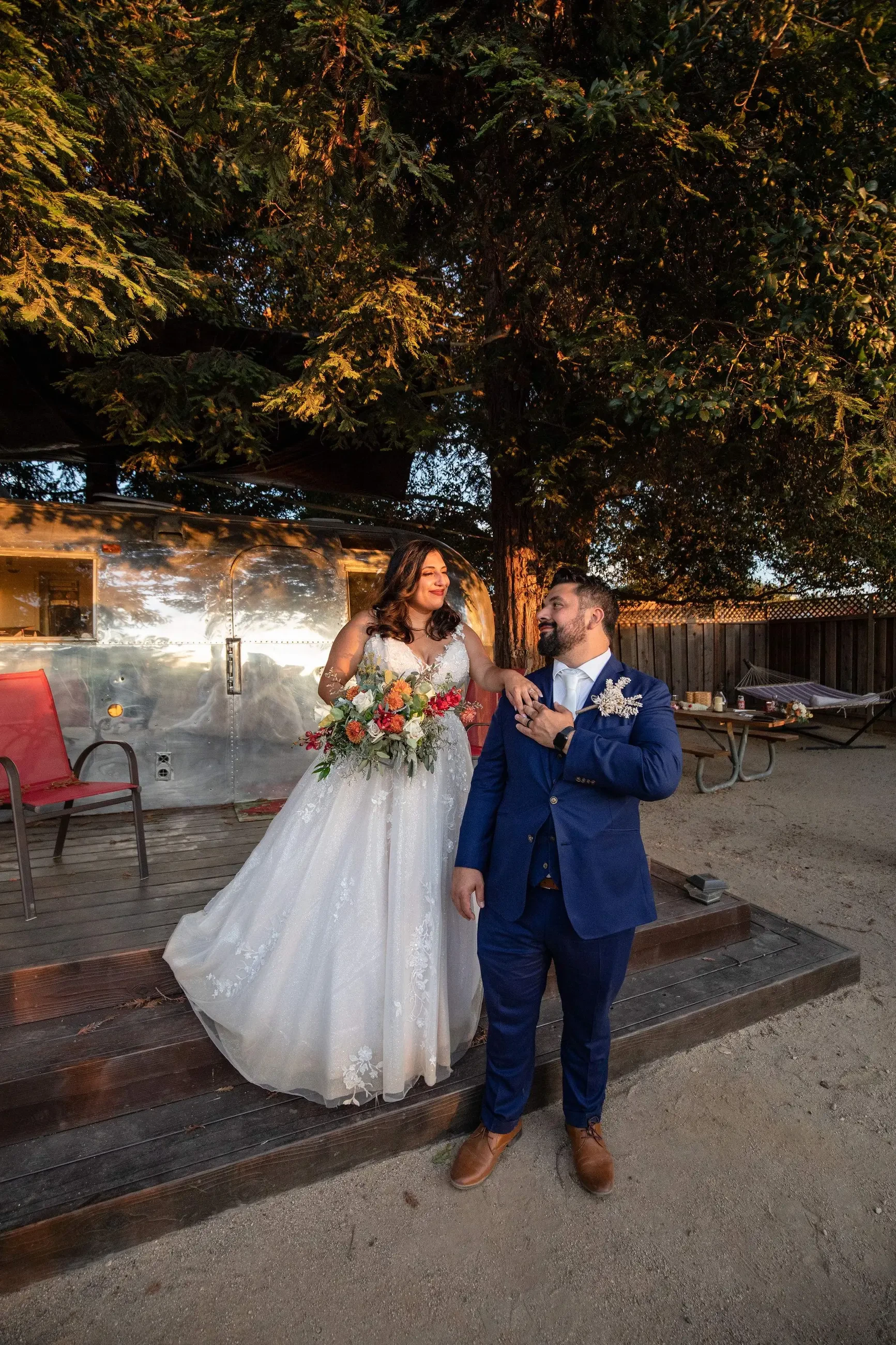 Сouple wearing a white gown and a blue suit