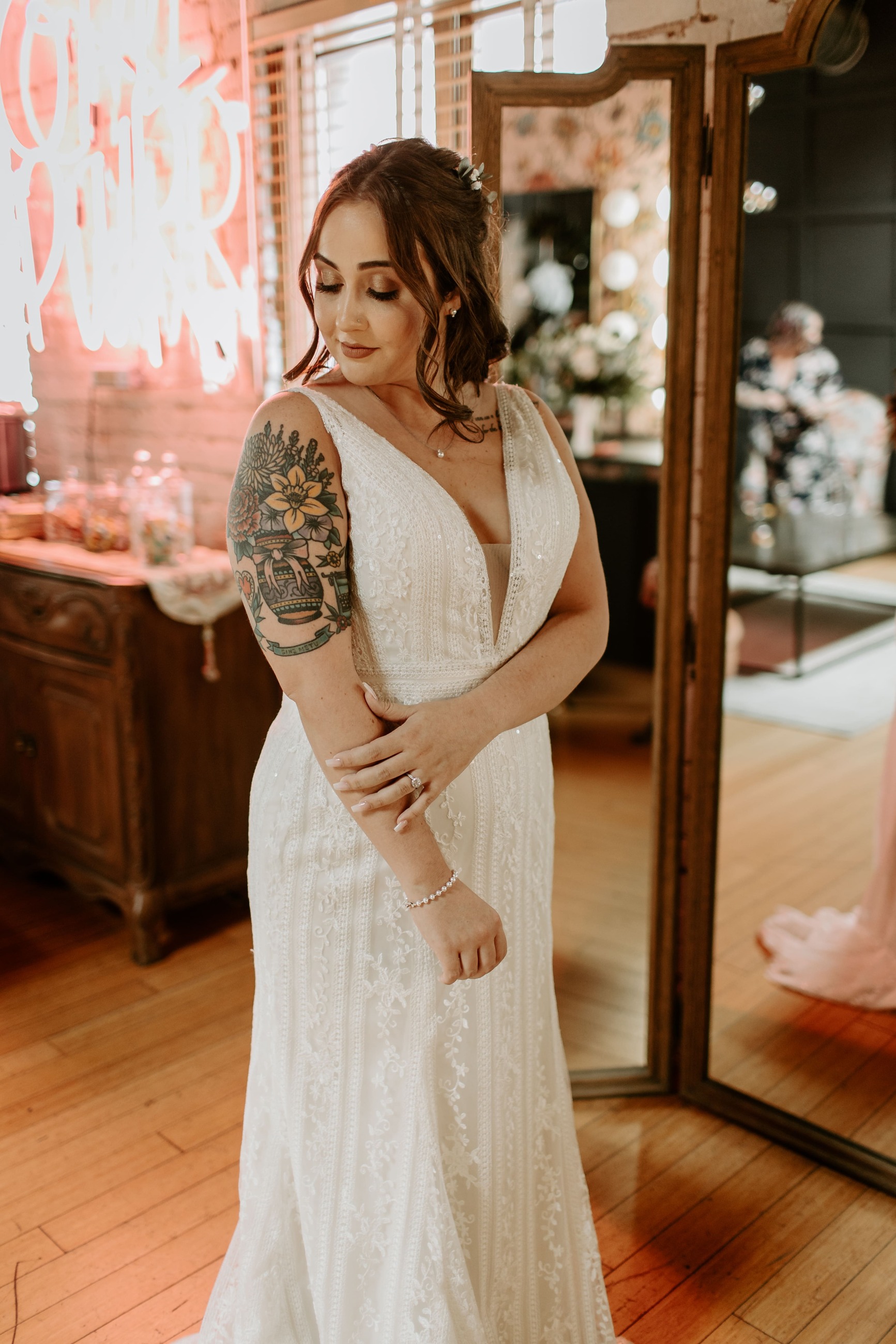Model wearing a bridal dress with tatoo