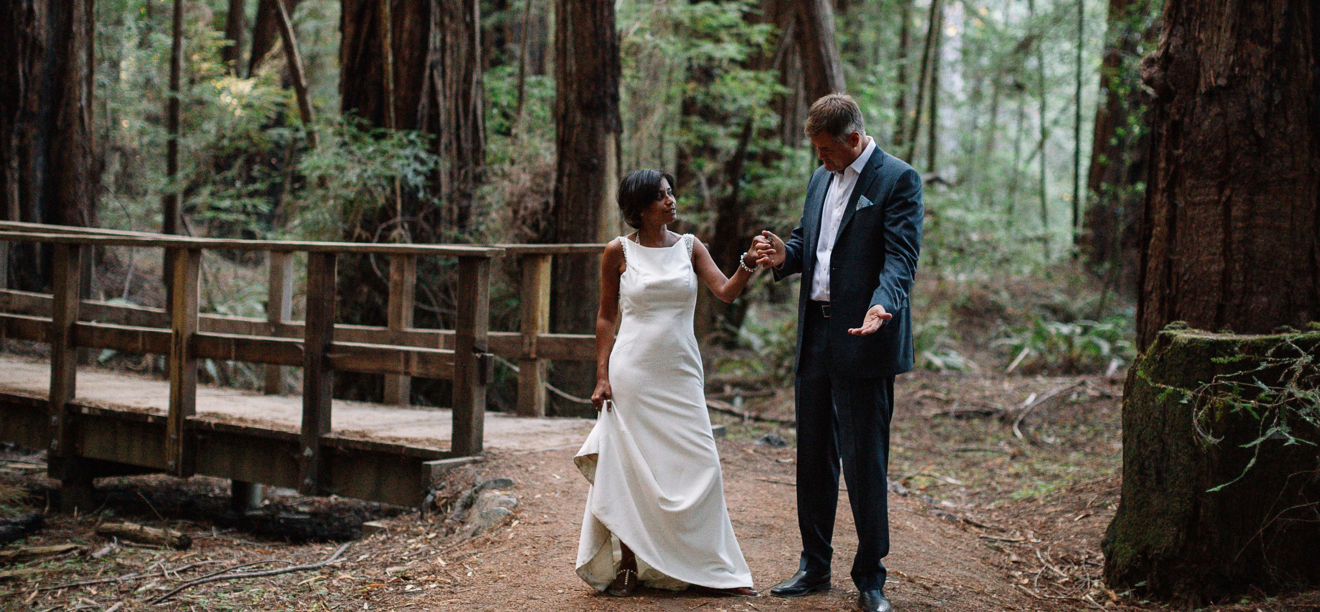 Сouple wearing a white gown and a black suit