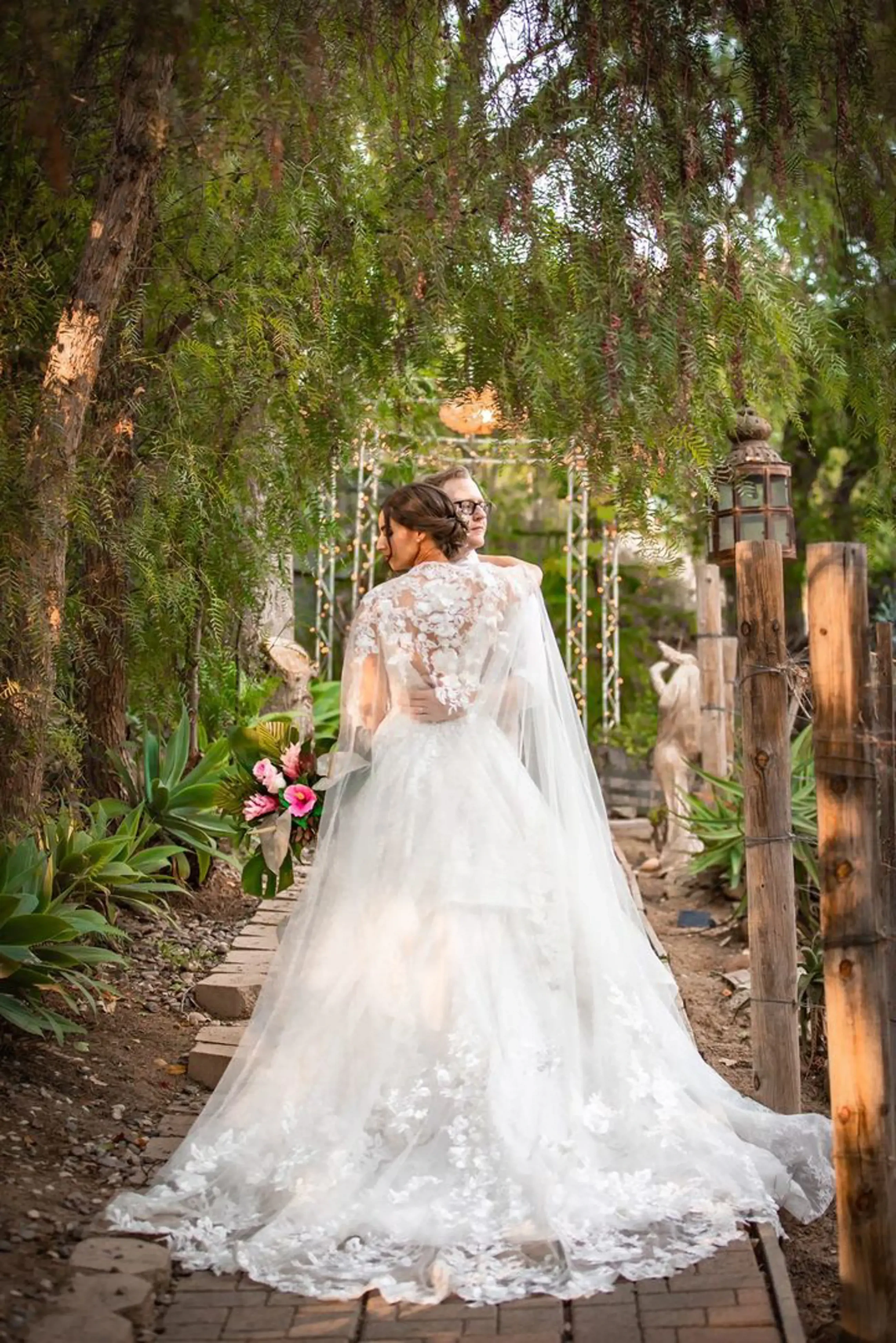 Сouple wearing a white gown and a black suit