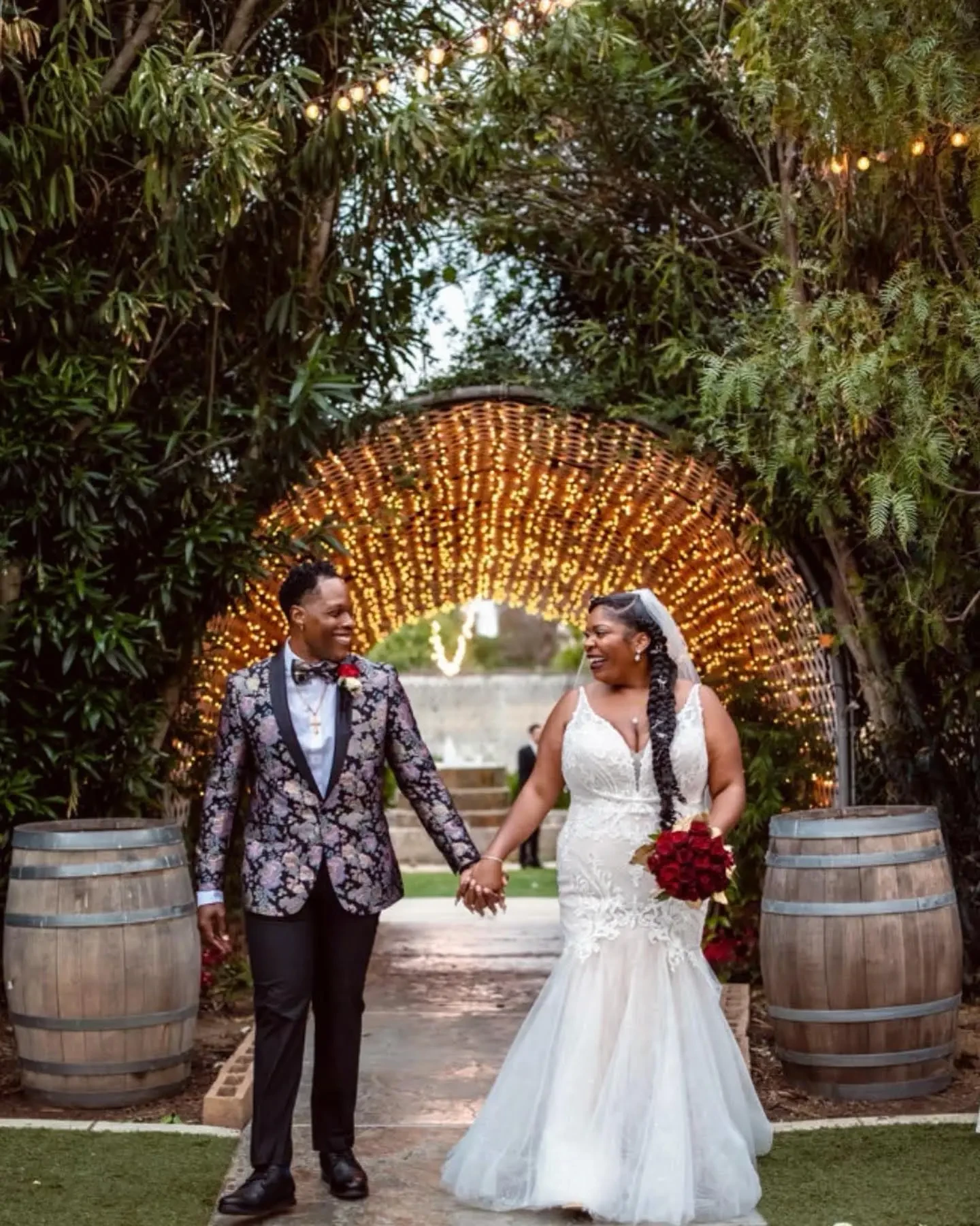 Сouple wearing a white gown and a brown suit