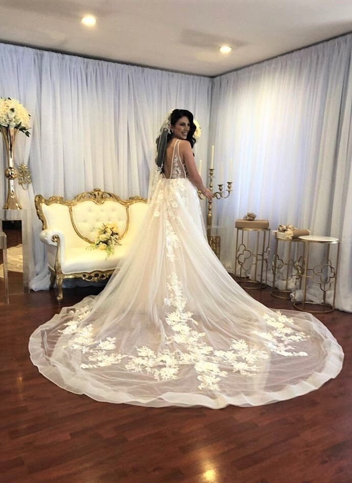 Model wearing a white gown in the hall