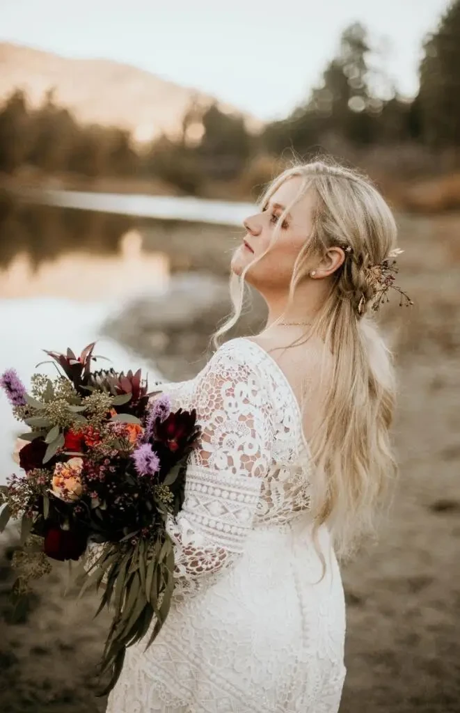 Model wearing a bridal dress with flowers