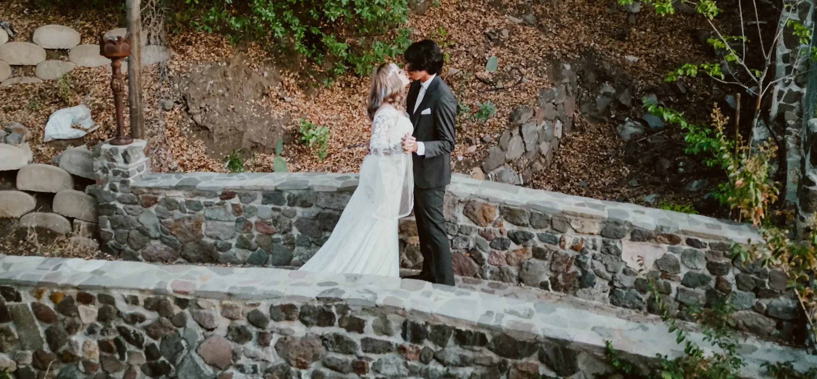 Сouple wearing a white gown and a black suit